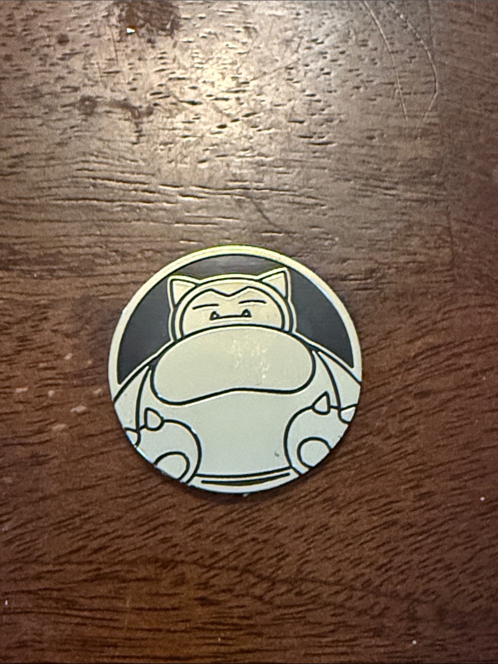 Snorlax pokemon coin - gold and Black